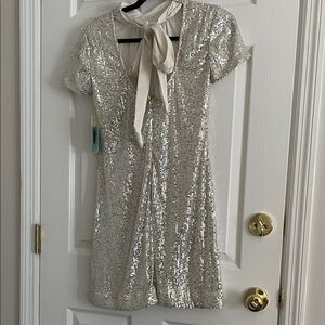 $119 msrp nwt cece Silver Sequin mini with Bow tie back xs
